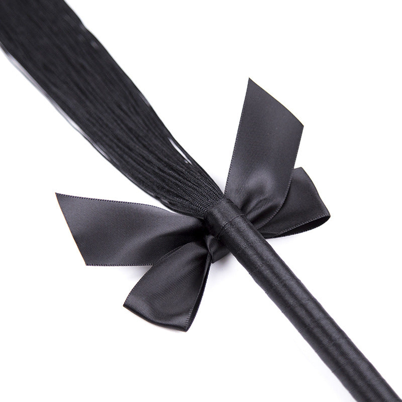Misfit Faux Leather Bow Flogger